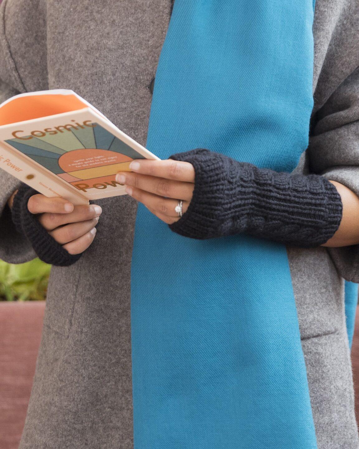 Hand-knitted black merino wool fingerless gloves by likemary, ethically made for sustainable living, warmth, and practical everyday use.